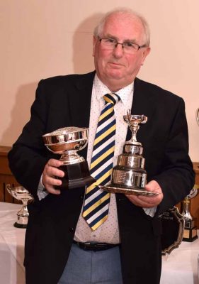 John Webster with two of his six awards